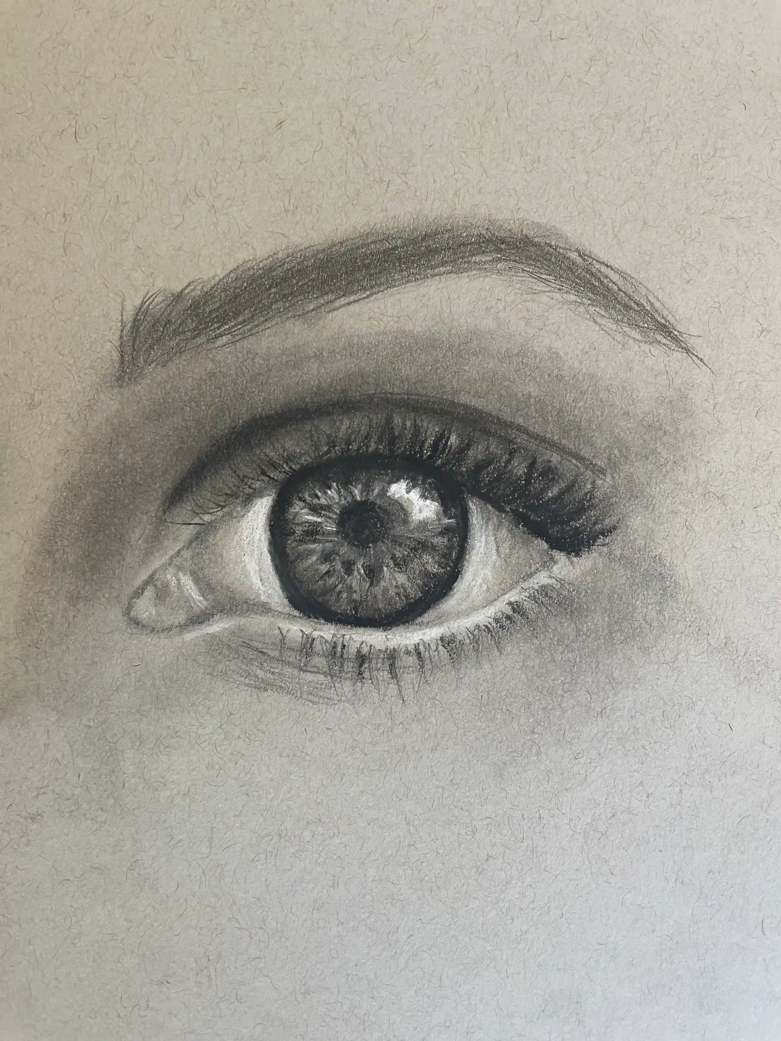 A close-up, black & white drawing of an eye